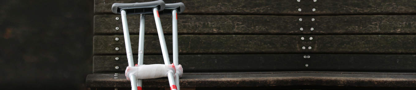 crutches at a park bench