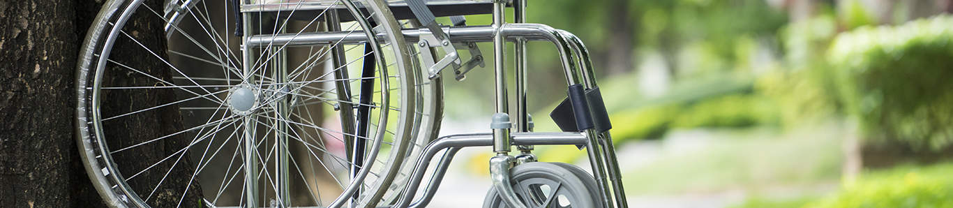 Empty wheelchair parked in park