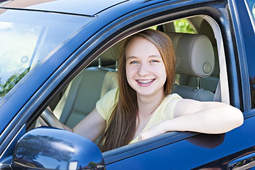 smiling teen girl driver | Keeping Teens Safe While Driving