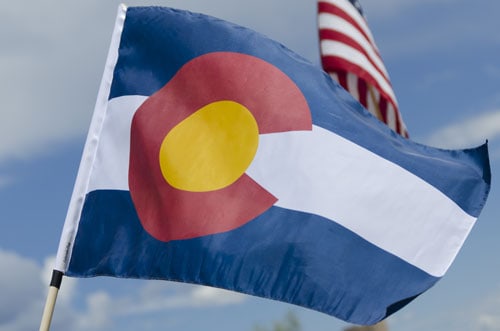 Colorado and american flags blowing in the wind | How Healthy are Coloradans?