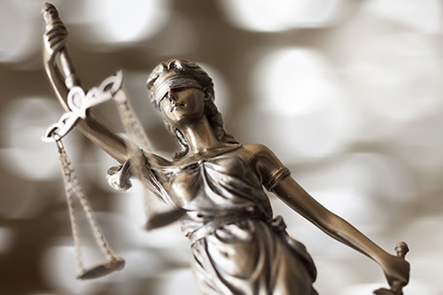 a statue of lady justice | things to consider before hiring a personal injury attorney