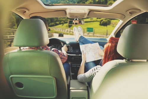 couple on road trip in the summer | Dangers of Summer Driving