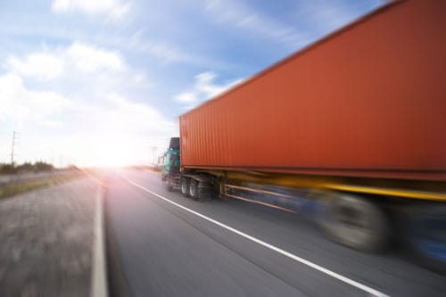 semi truck speeding down the highway | Do You Need a Lawyer After a Trucking Accident?