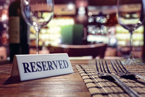 reserved sign on set table in restaurant | Restaurant Liability Accidents