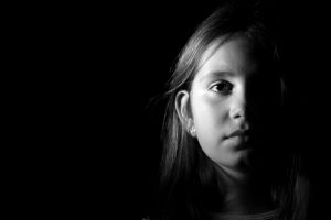 picture of a girl in shadow | Preventable Accidents Involving Guns and Cars