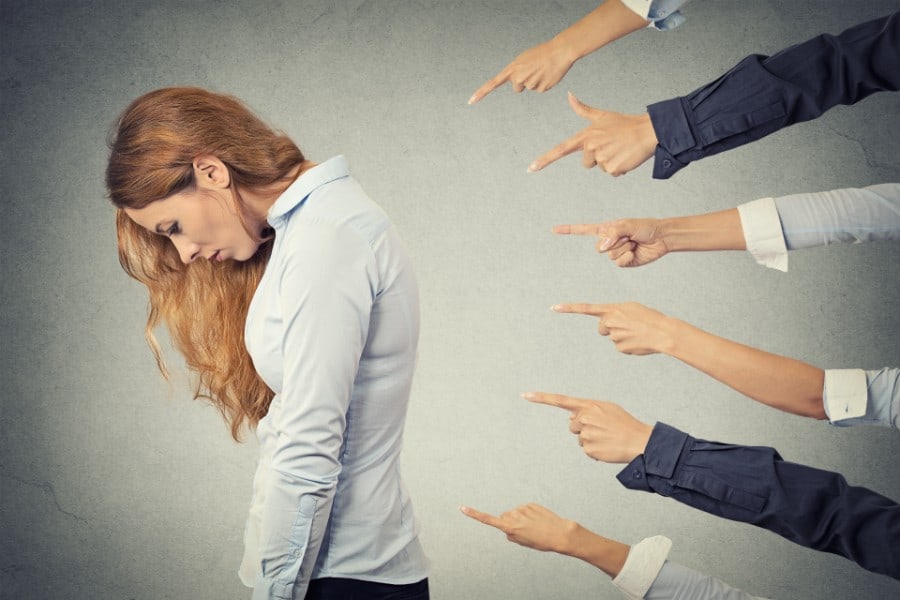 woman turning her back while fingers are beigng pointed at her | Shifting Blame after a Slip and Fall Accident