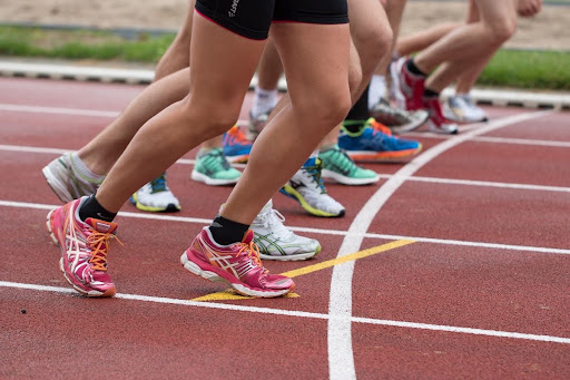 Runners lined up at the start of a track race